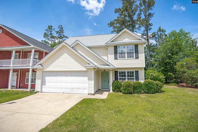 traditional-style house with a garage, concrete driveway, and a front lawn