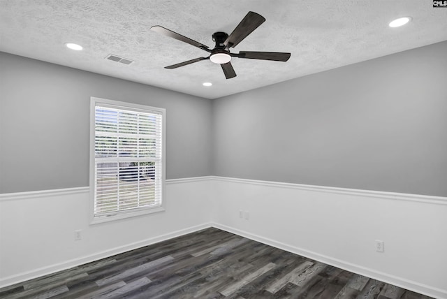 spare room with ceiling fan, a textured ceiling, visible vents, recessed lighting, and dark wood-type flooring