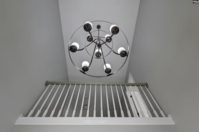 interior details featuring an inviting chandelier