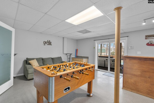 recreation room with a drop ceiling
