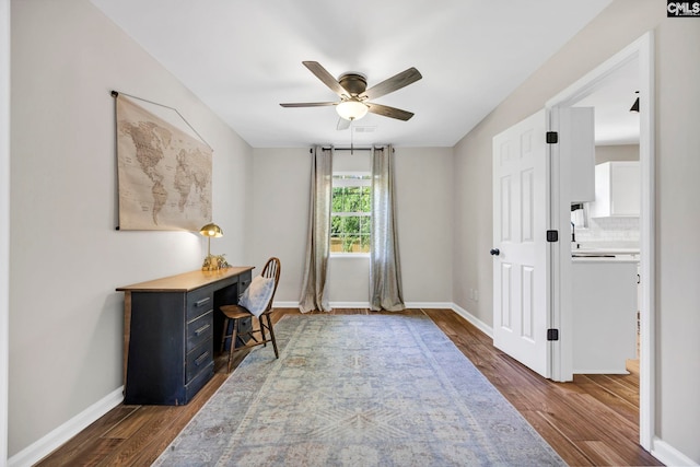 office area featuring a ceiling fan, baseboards, and wood finished floors
