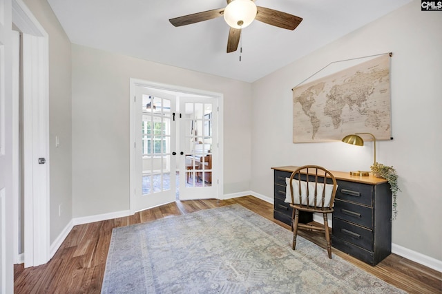 office space featuring baseboards, a ceiling fan, french doors, and wood finished floors