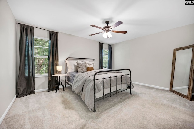 bedroom with carpet flooring, baseboards, and ceiling fan