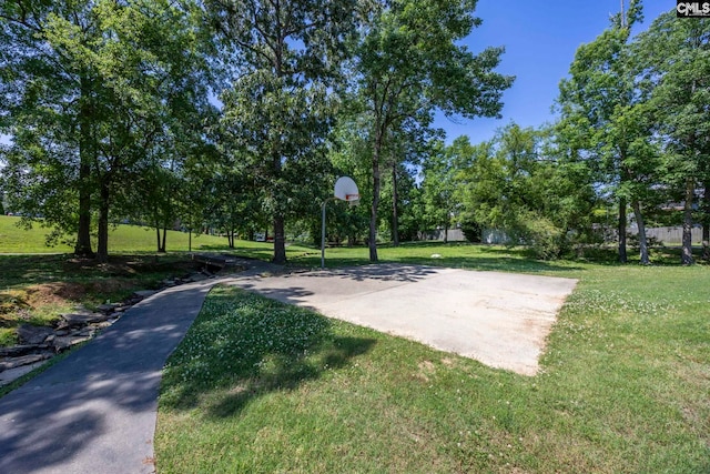 view of sport court featuring a lawn and community basketball court