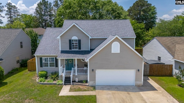 traditional-style house with fence, a shingled roof, a front lawn, a garage, and a porch