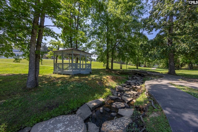 surrounding community featuring a lawn and a gazebo