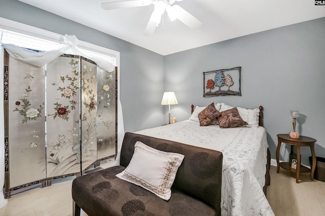 bedroom with ceiling fan and light wood finished floors