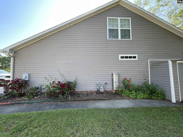 view of property exterior featuring a yard