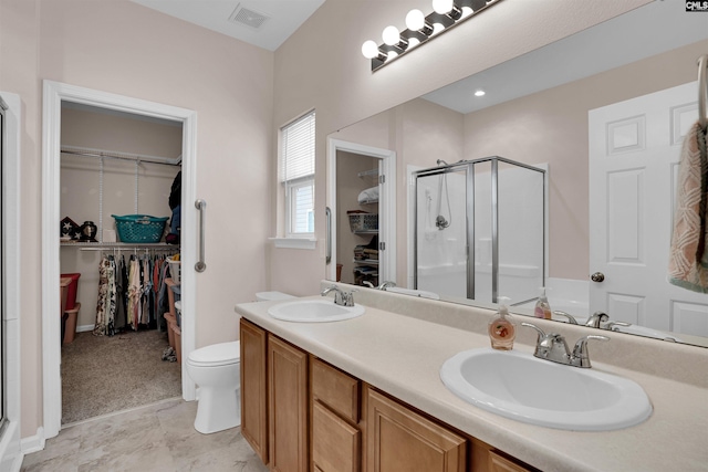 472 Westmoreland Rd, Columbia, SC 29229 - bathroom featuring a sink, a walk in closet, a stall shower, and visible vents