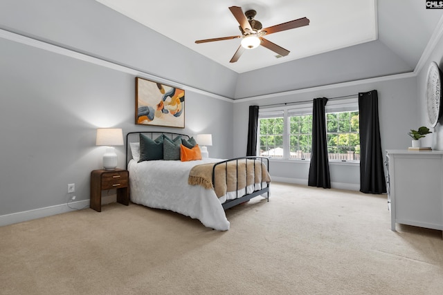 bedroom featuring light colored carpet, baseboards, ceiling fan, and vaulted ceiling