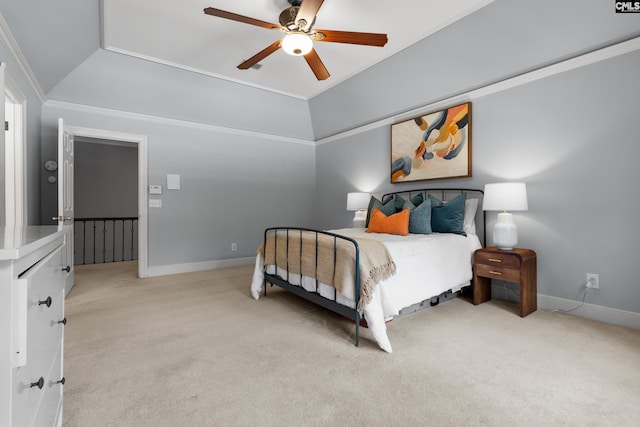 bedroom featuring crown molding, a tray ceiling, light colored carpet, and baseboards