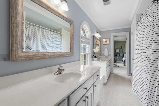 full bathroom featuring crown molding, a sink, ensuite bath, two vanities, and visible vents