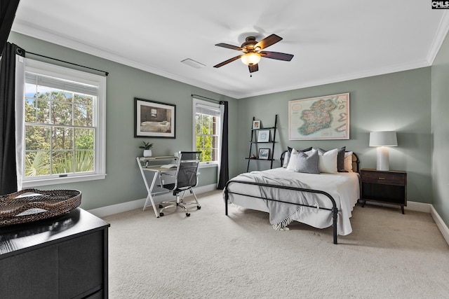 bedroom with crown molding, baseboards, and light carpet