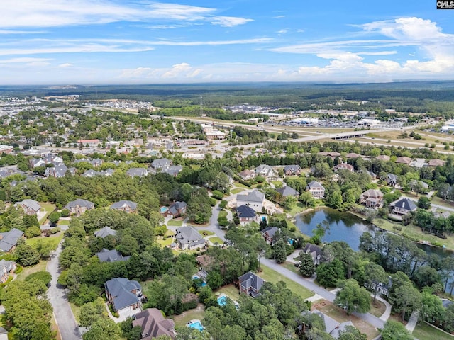 birds eye view of property featuring a residential view and a water view