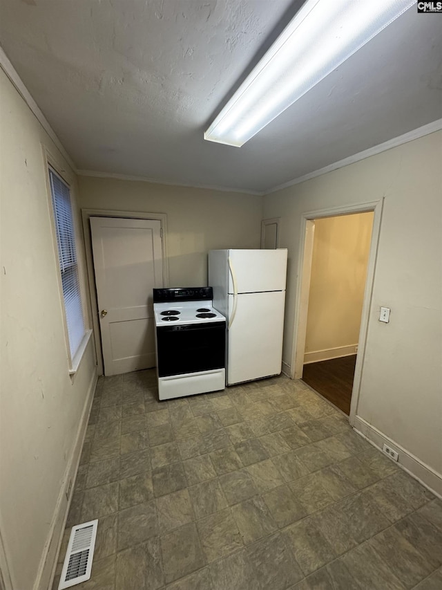 4906 Bethel Church Rd, Columbia, SC 29206 - kitchen featuring baseboards, freestanding refrigerator, range with electric cooktop, and visible vents