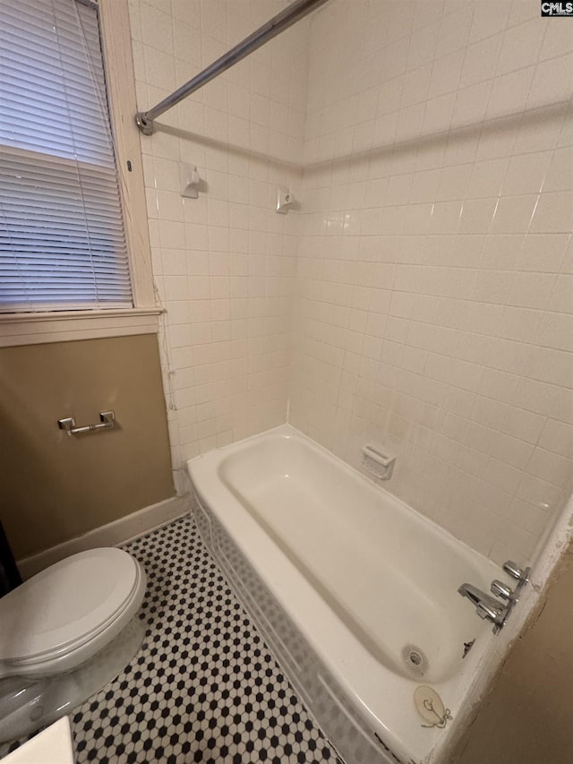 4906 Bethel Church Rd, Columbia, SC 29206 - bathroom featuring shower / bathing tub combination, tile patterned floors, and toilet