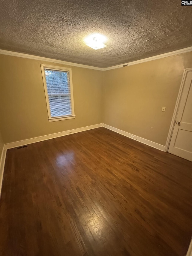 4906 Bethel Church Rd, Columbia, SC 29206 - unfurnished room with ornamental molding, a textured ceiling, and dark wood-style flooring
