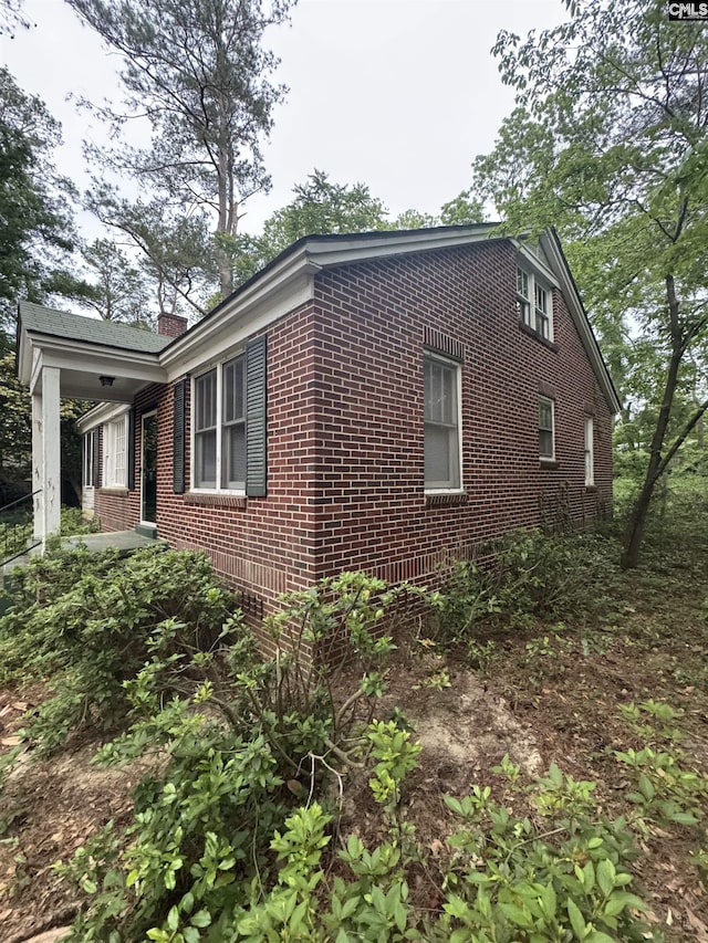 4906 Bethel Church Rd, Columbia, SC 29206 - view of side of property featuring brick siding and a chimney