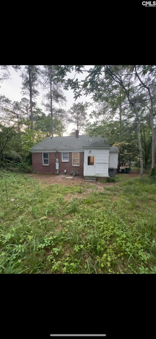 4906 Bethel Church Rd, Columbia, SC 29206 - back of property featuring a chimney