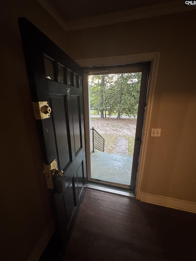 4906 Bethel Church Rd, Columbia, SC 29206 - doorway to outside featuring baseboards, ornamental molding, and wood finished floors