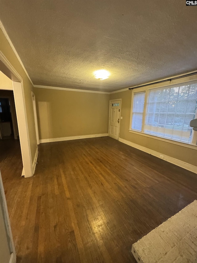 4906 Bethel Church Rd, Columbia, SC 29206 - unfurnished living room with baseboards, ornamental molding, a textured ceiling, and dark wood-type flooring