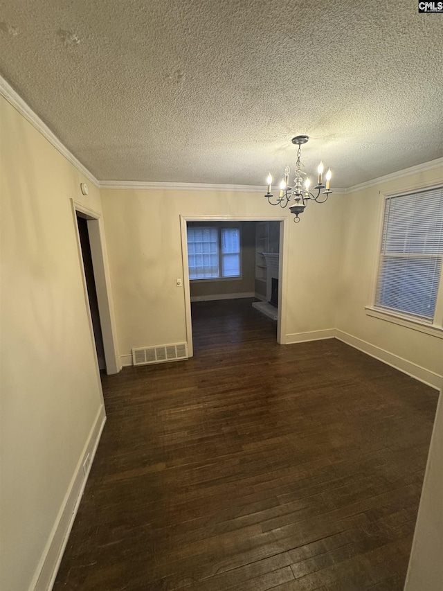 4906 Bethel Church Rd, Columbia, SC 29206 - unfurnished dining area featuring crown molding, a notable chandelier, dark wood-type flooring, and visible vents
