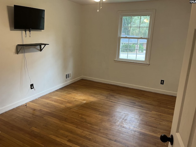 906 Brantley St, Columbia, SC 29210 - empty room featuring visible vents, baseboards, and hardwood / wood-style flooring
