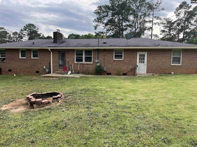 906 Brantley St, Columbia, SC 29210 - rear view of house with a patio, a chimney, brick siding, crawl space, and an outdoor fire pit