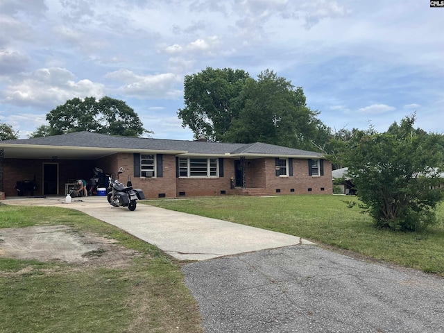906 Brantley St, Columbia, SC 29210 - ranch-style house featuring crawl space, brick siding, a front lawn, concrete driveway, and an attached carport