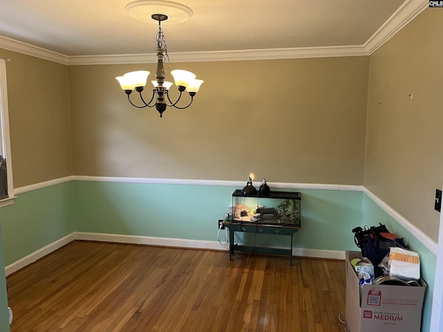 906 Brantley St, Columbia, SC 29210 - unfurnished dining area with an inviting chandelier, ornamental molding, wood-type flooring, and baseboards