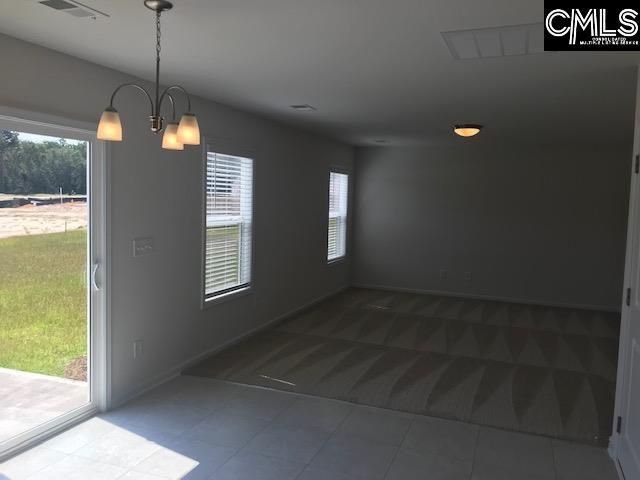 730 Lansford Bay Dr, West Columbia, SC 29172 - unfurnished dining area featuring visible vents, tile patterned flooring, baseboards, carpet flooring, and a notable chandelier
