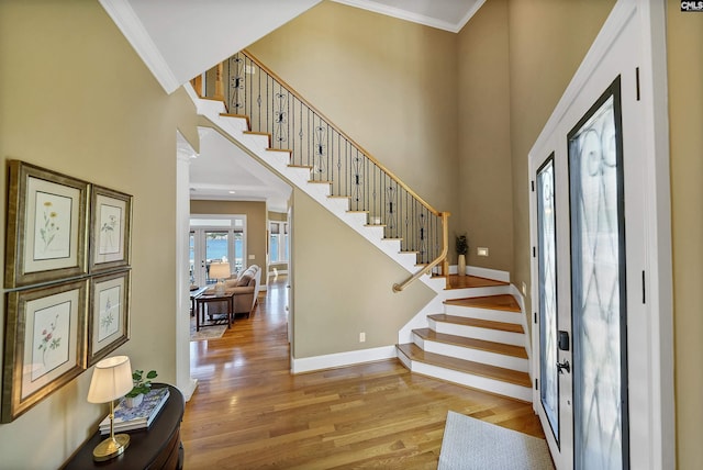 305 Marina Ct, Lexington, SC 29072 - foyer entrance with a towering ceiling, crown molding, wood finished floors, baseboards, and stairs