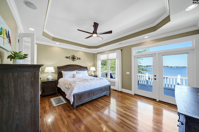 305 Marina Ct, Lexington, SC 29072 - bedroom featuring a tray ceiling, ornamental molding, wood finished floors, and access to exterior