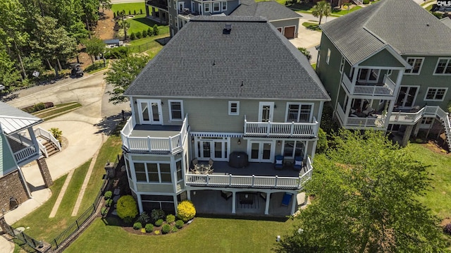 305 Marina Ct, Lexington, SC 29072 - back of house featuring a lawn, roof with shingles, and french doors