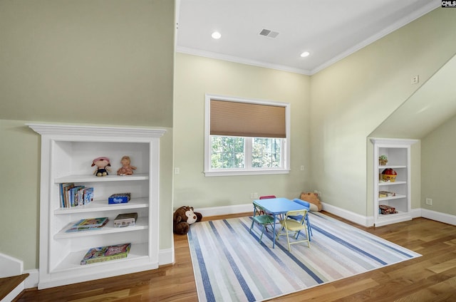 305 Marina Ct, Lexington, SC 29072 - rec room with visible vents, built in features, wood finished floors, baseboards, and ornamental molding