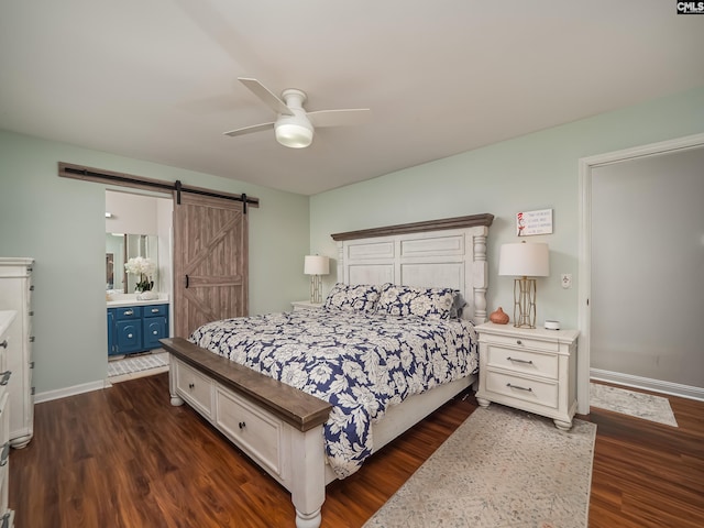 bedroom with baseboards, a ceiling fan, dark wood-style flooring, and a barn door