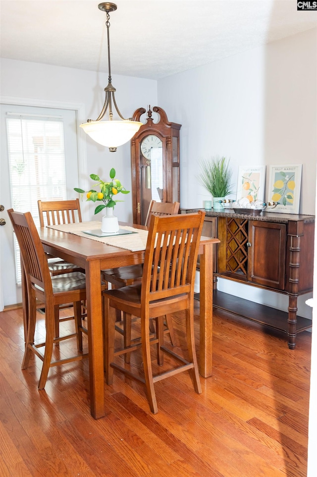 dining space featuring light wood-type flooring