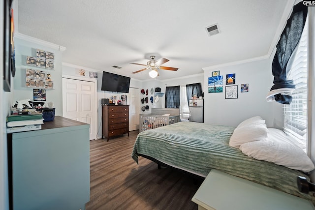 120 Coventry Lake Dr, Lexington, SC 29072 - bedroom with ornamental molding, dark wood-style flooring, a ceiling fan, and a closet