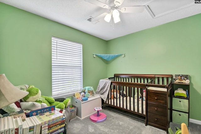 carpeted bedroom with a ceiling fan, visible vents, and multiple windows