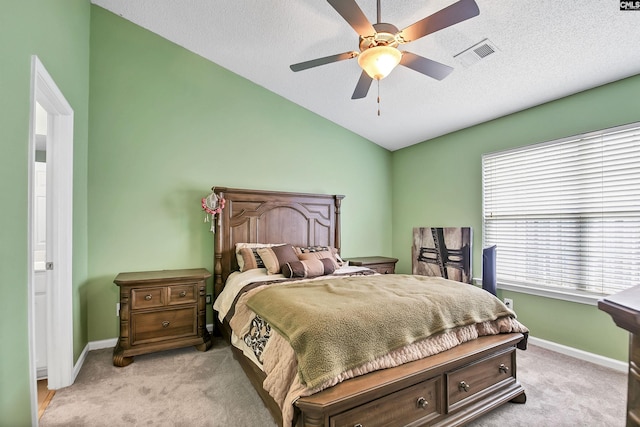 bedroom featuring baseboards, light carpet, vaulted ceiling, and visible vents