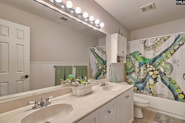 full bath with double vanity, tile patterned floors, visible vents, and a sink