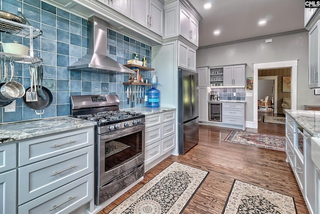 215 Greenbrier Mossydale Rd, Winnsboro, SC 29180 - kitchen featuring wall chimney range hood, open shelves, appliances with stainless steel finishes, decorative backsplash, and wine cooler