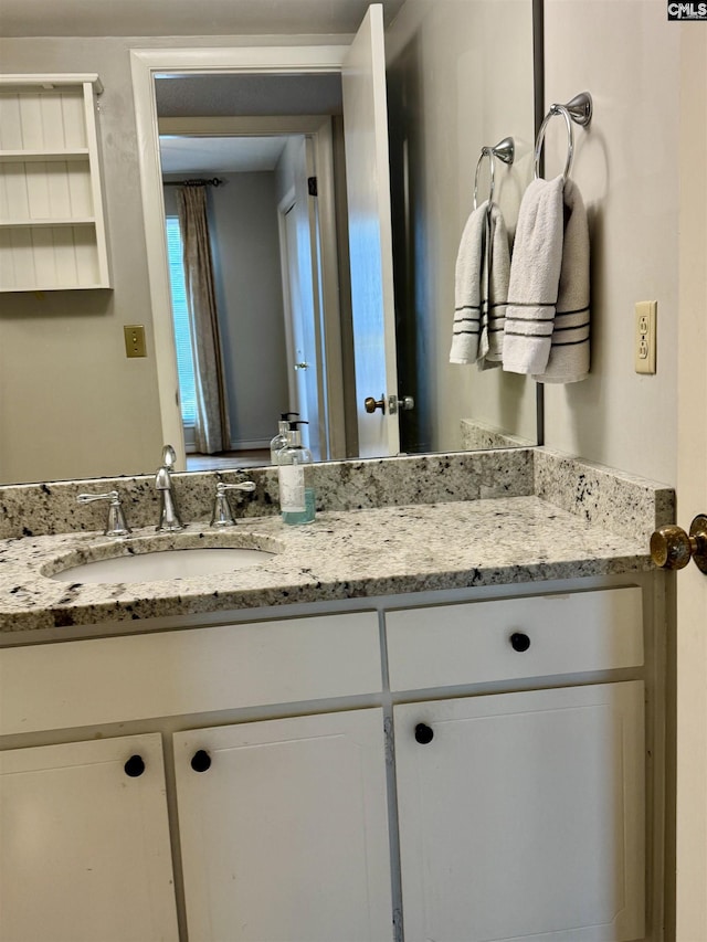 half bath featuring vanity