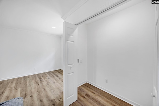 unfurnished room with crown molding, baseboards, recessed lighting, and wood finished floors