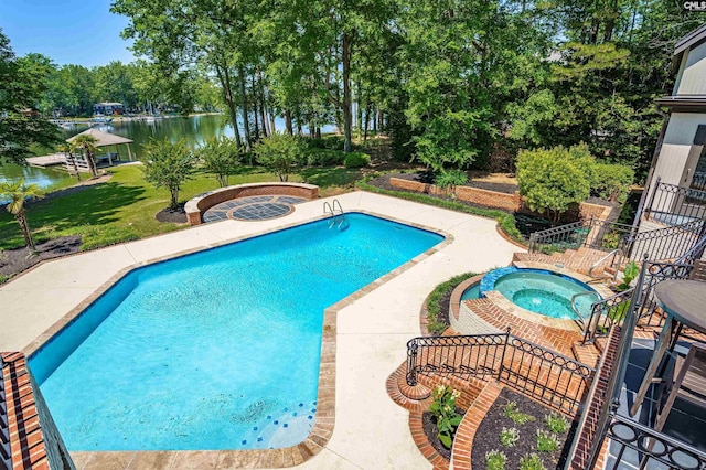 outdoor pool featuring a water view, a patio, an in ground hot tub, and a lawn