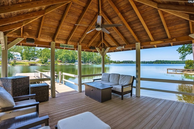 view of dock featuring an outdoor living space, a water view, and boat lift