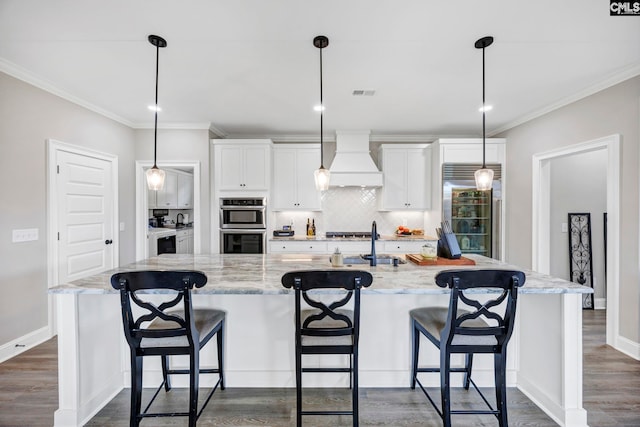2358 High Bluff Loop, Lexington, SC 29072 - kitchen with stainless steel appliances, white cabinetry, decorative backsplash, a large island with sink, and custom exhaust hood