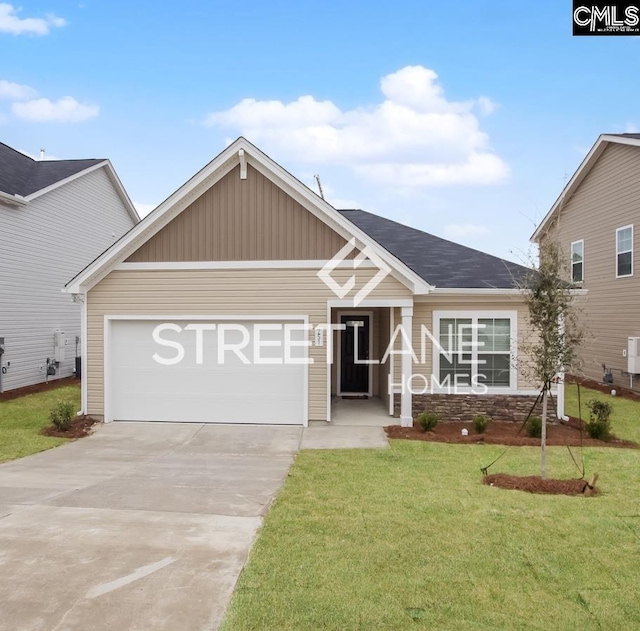 craftsman house featuring concrete driveway, a front yard, an attached garage, and board and batten siding