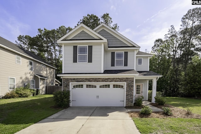 craftsman house featuring stone siding, an attached garage, driveway, and a front yard