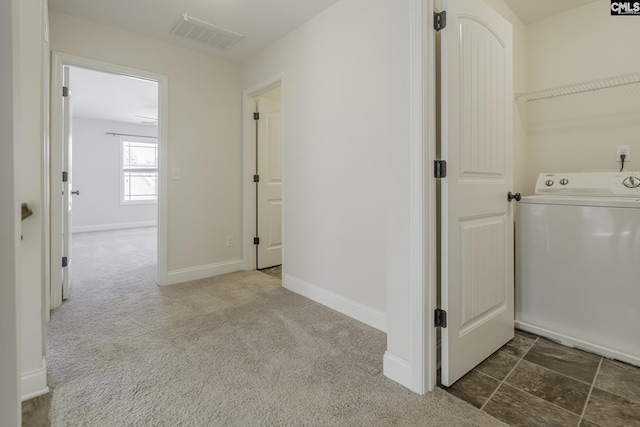 laundry area with washer / dryer, baseboards, carpet flooring, and visible vents